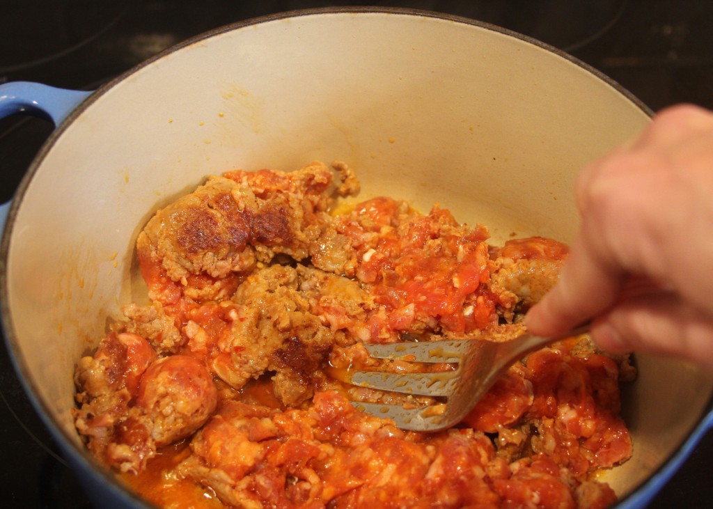 spicy Italian sausage in pan
