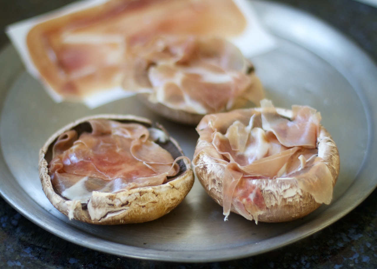 Baked Eggs in ProsciuttoFilled Portobello Mushroom Caps